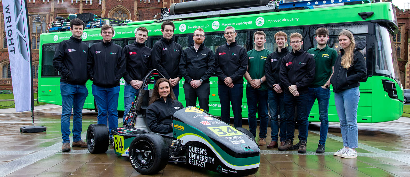 Students and Wrightbus team with electric race car at Queens University