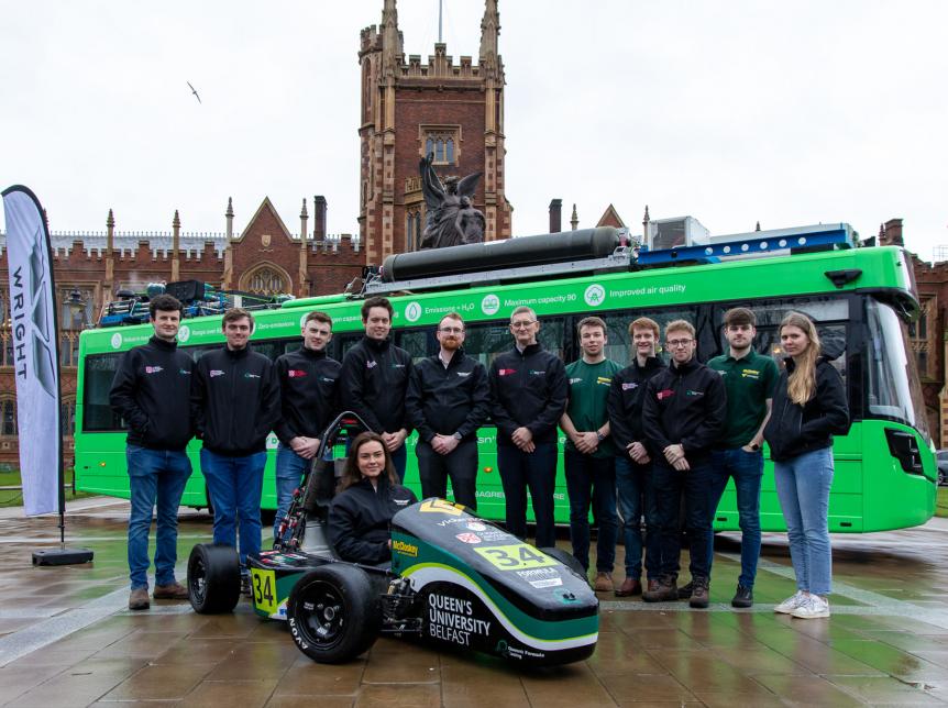Students and Wrightbus team with electric race car at Queens University