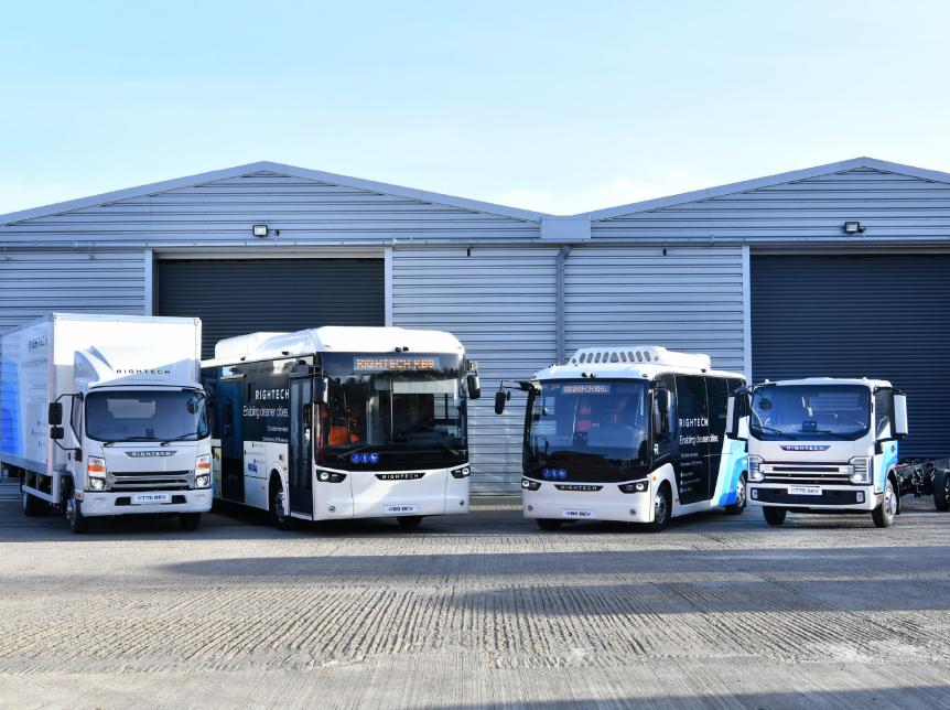 line up of electric buses and trucks