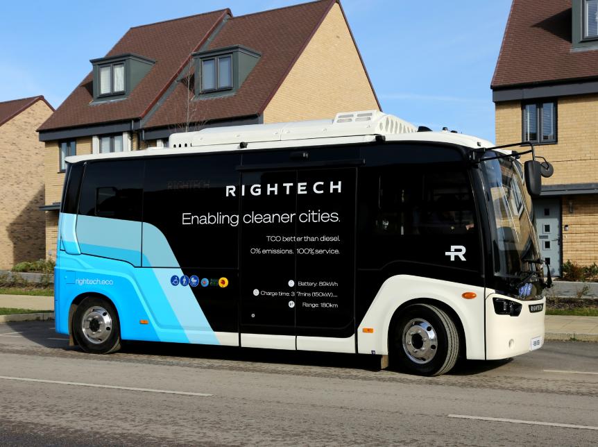 Rightech 6 metre bus parked in front of housing
