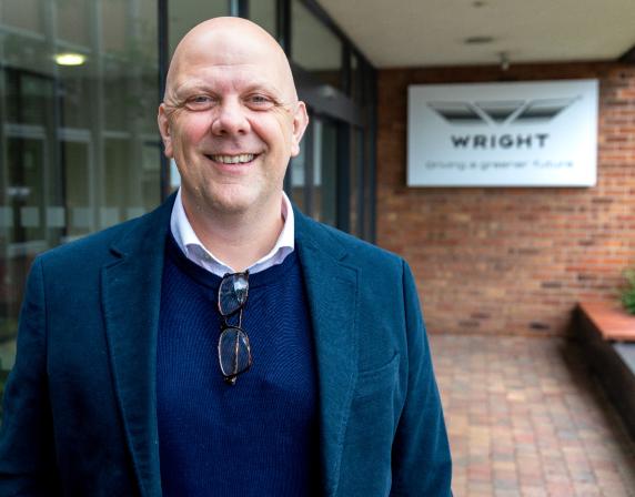 Christian Reynolds standing outside the Wrightbus factory main entrance
