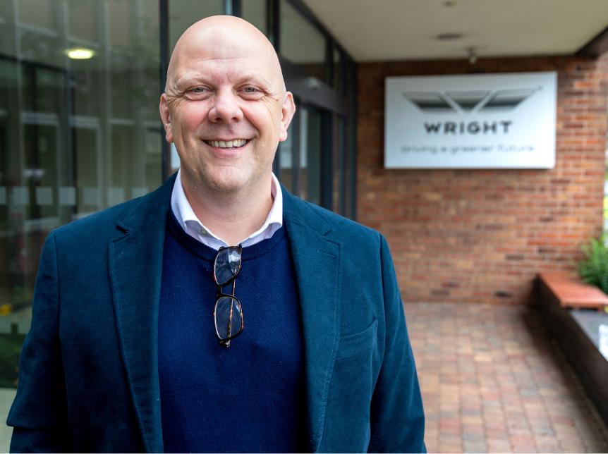 Christian Reynolds standing outside the Wrightbus factory main entrance
