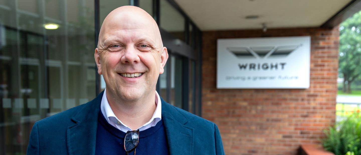 Christian Reynolds standing outside the Wrightbus factory main entrance