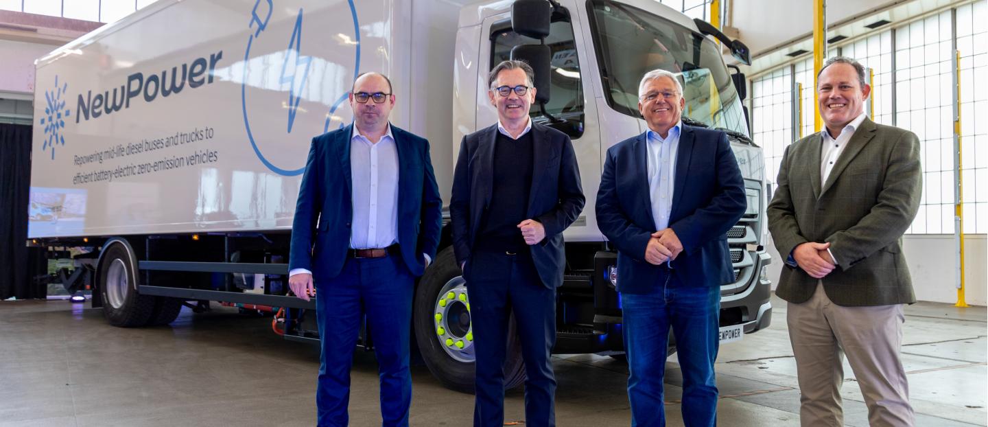 Group of senior leadership at Wrightbus standing in front of of a repowered DAF truck