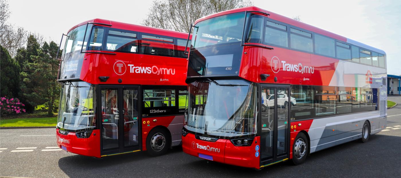 two Wrightbus double deck buses with TrawsCymru liveries. the buses are parked side by side